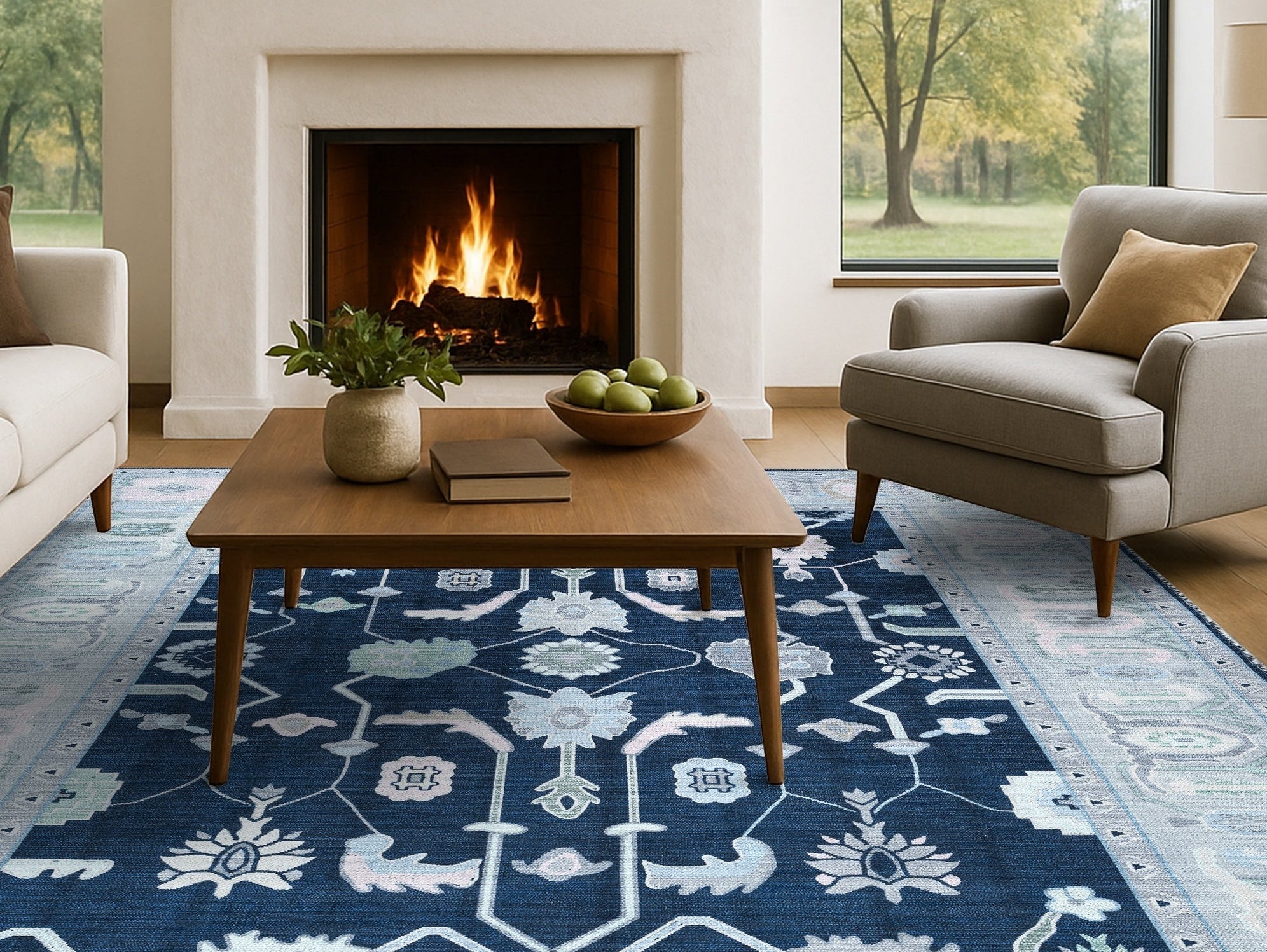 Living room featuring a bold navy blue area rug, adding vibrant color, depth, and personality to a neutral modern interior.