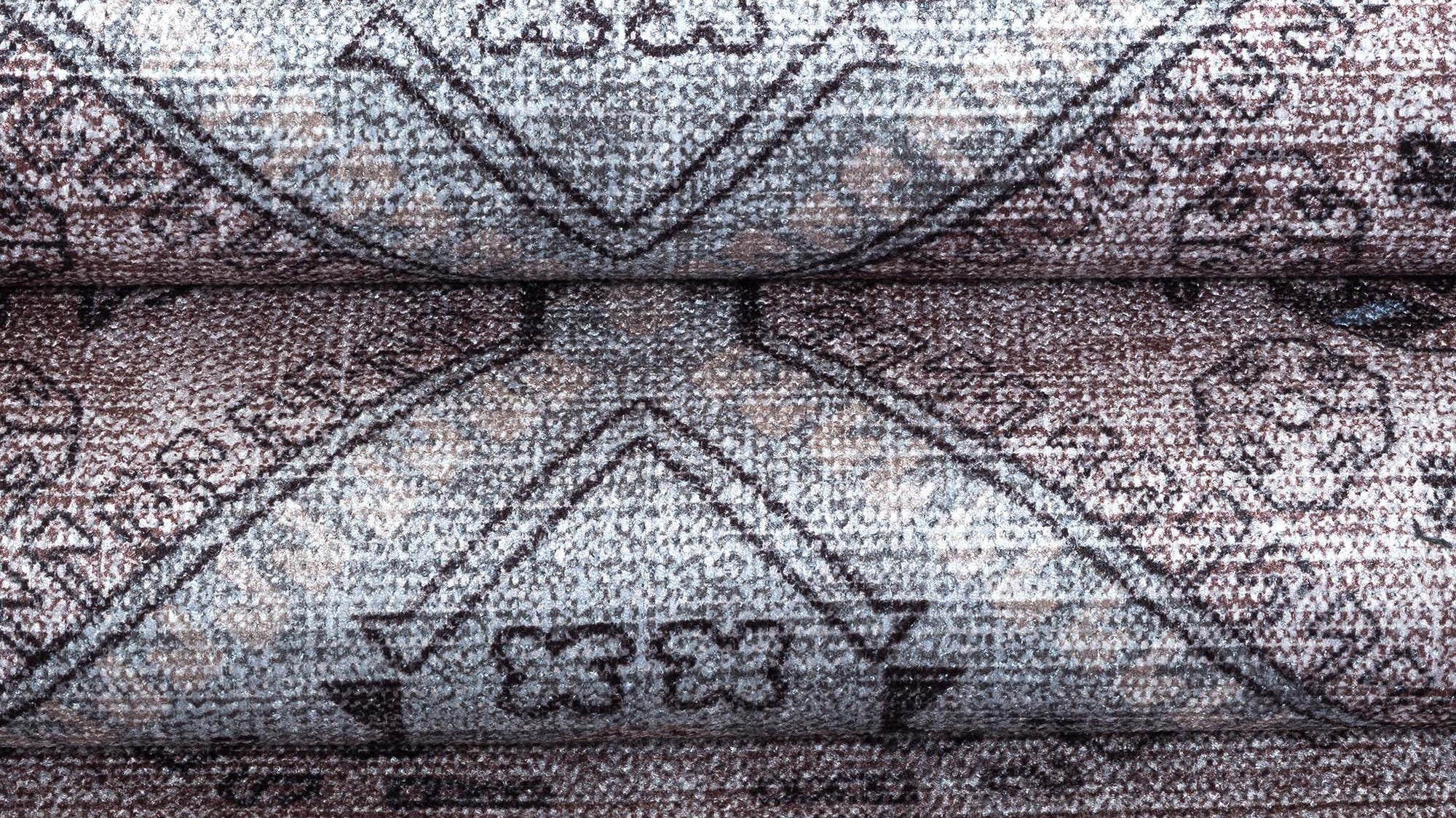 Close-up view of rug fibers and weaving details highlighting craftsmanship and material quality