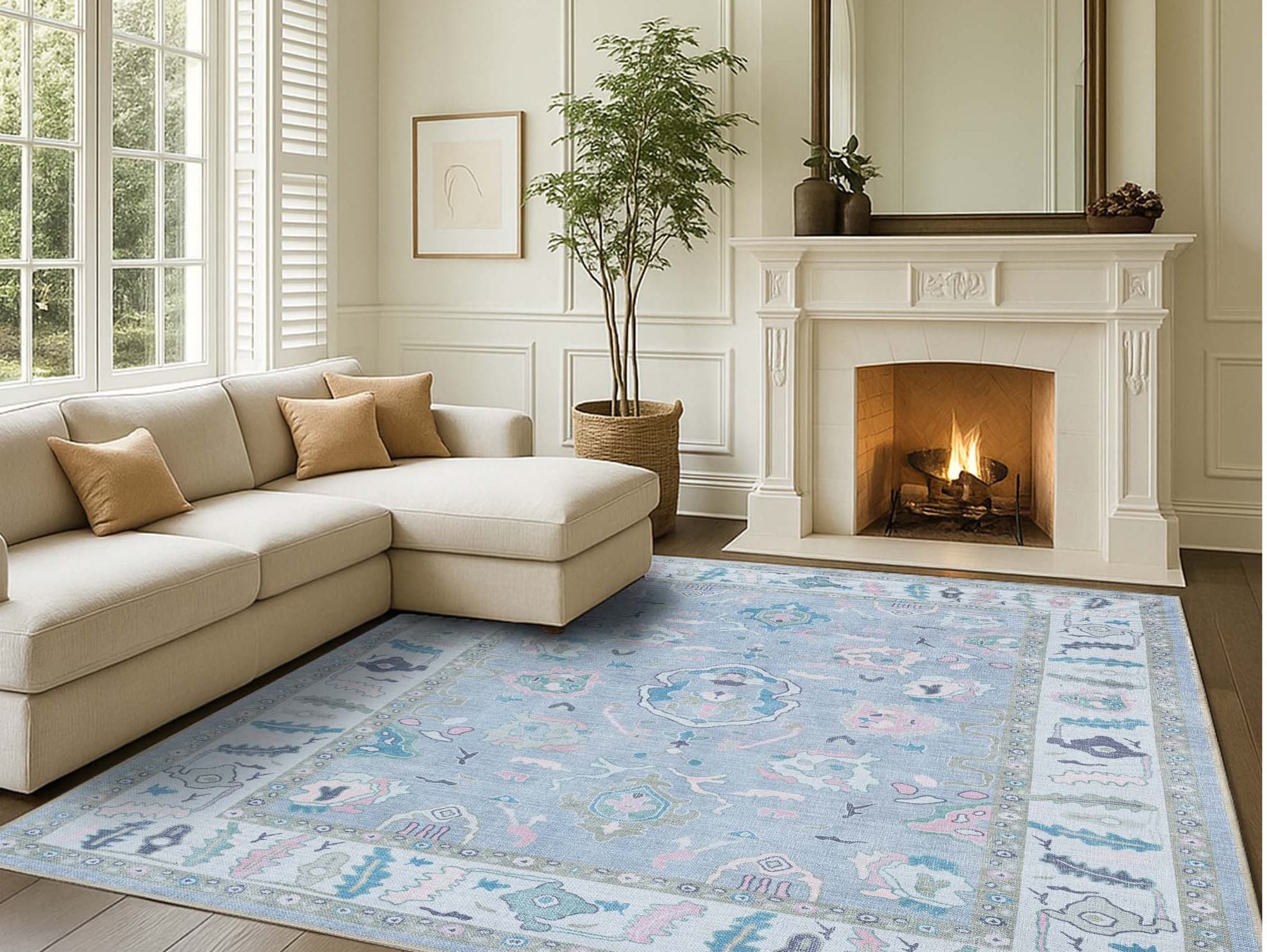 Minimalist living room styled with a soft Oushak rug, adding subtle pattern and warmth to the clean, modern space.