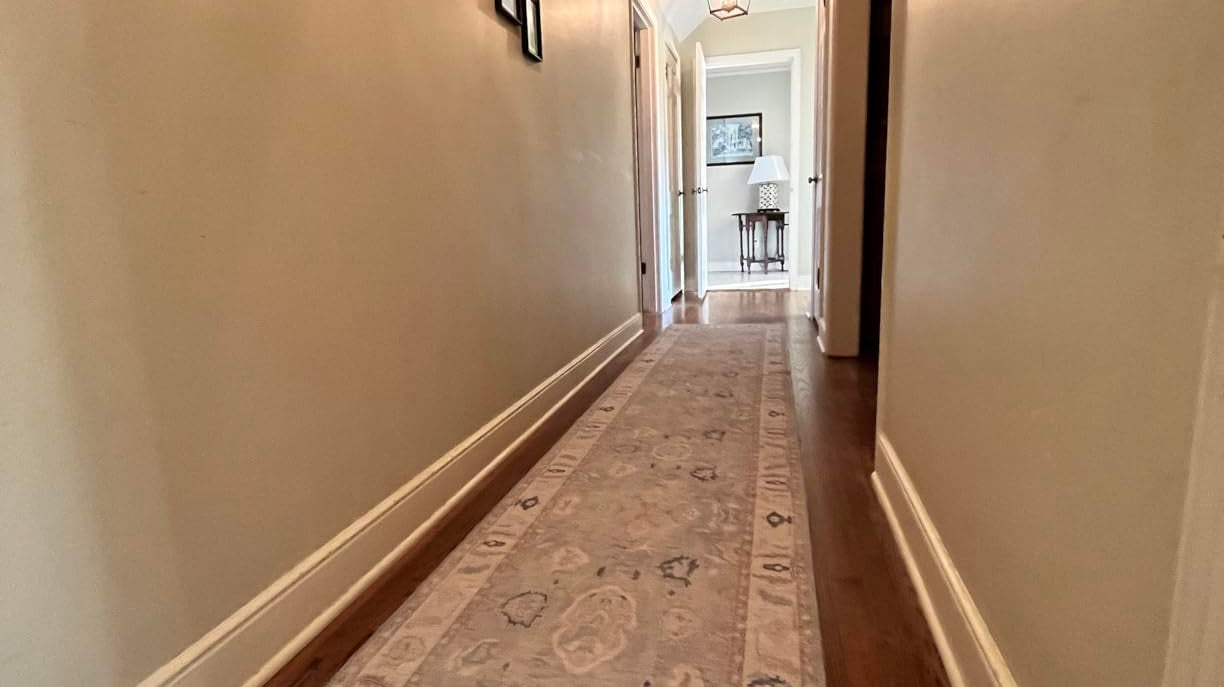 Washable gray Oushak runner rug enhancing a bright hallway with vintage-inspired charm