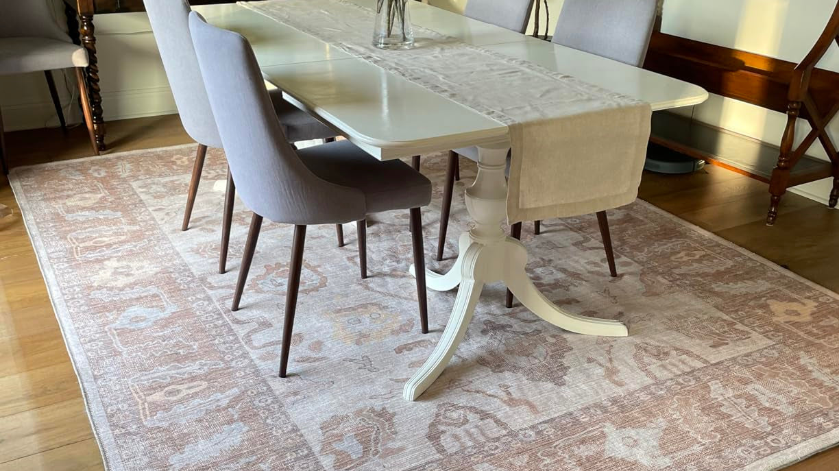 Neutral washable rug styled in a dining room, combining practical rug care with elegant interior design.