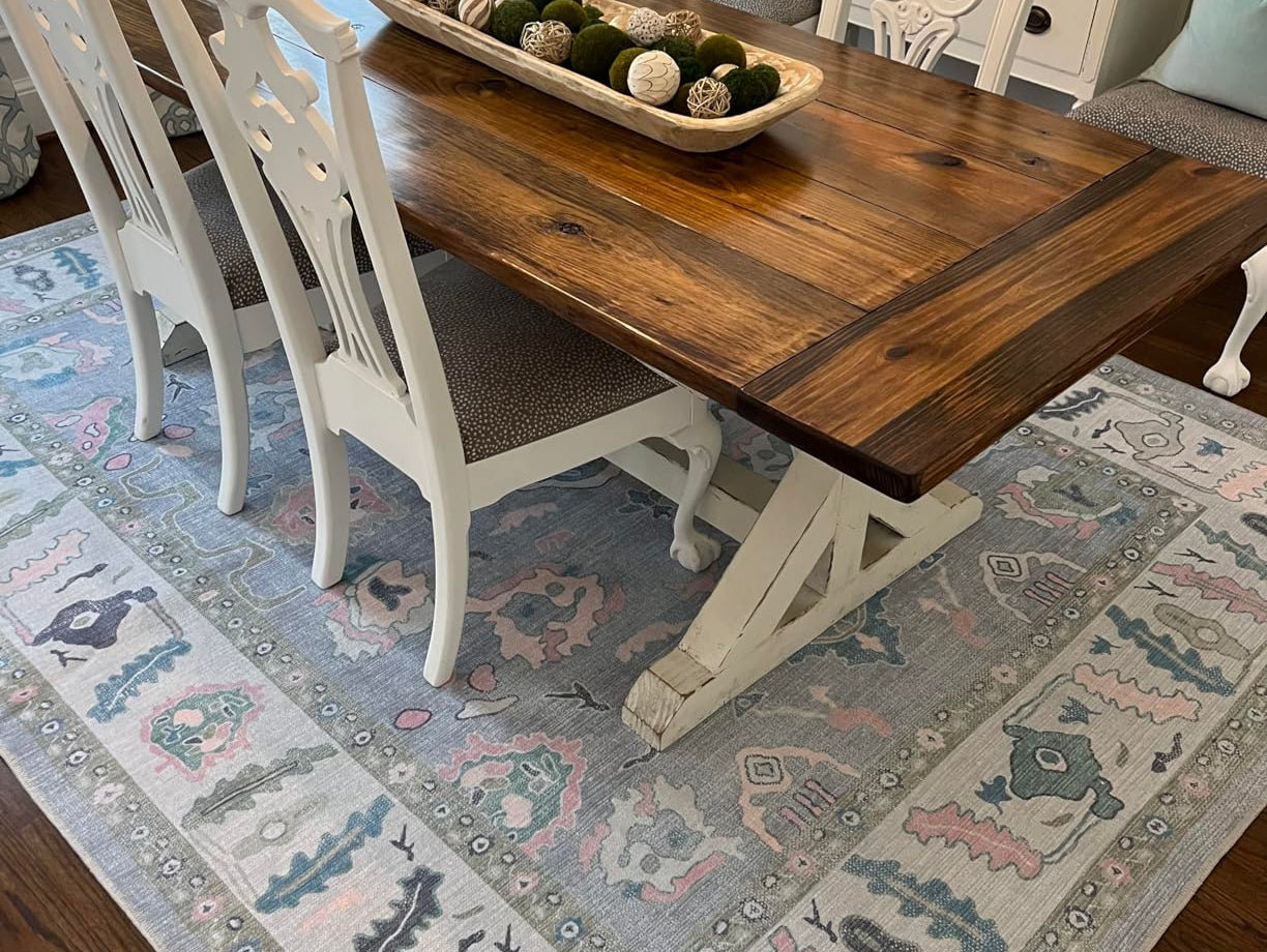 Colorful stylish washable rug anchoring a dining room, adding warmth, personality, and visual balance to the space