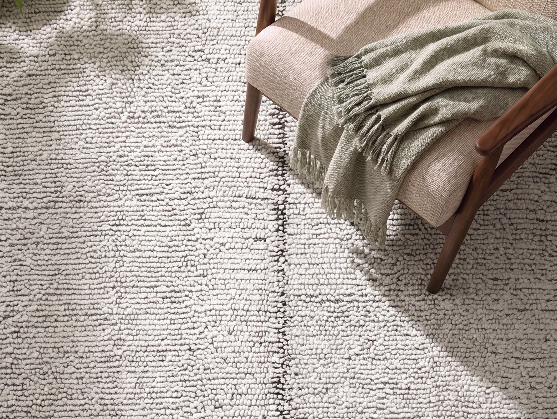 Handwoven wool Kilim rug featuring a modern bordered grid design in cream, and warm beige.