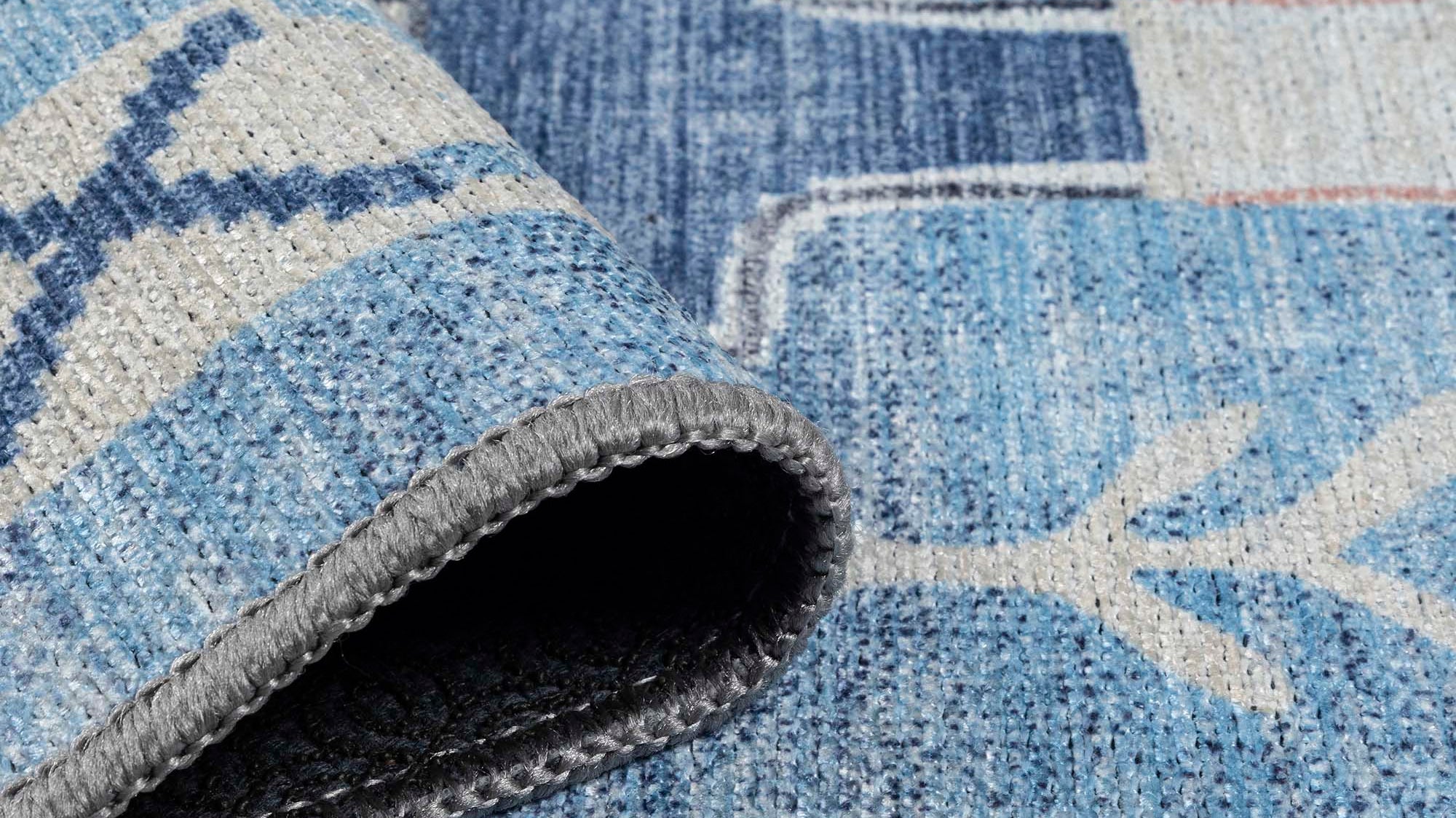 Close-up of a washable spring area rug highlighting soft colors and clean woven texture