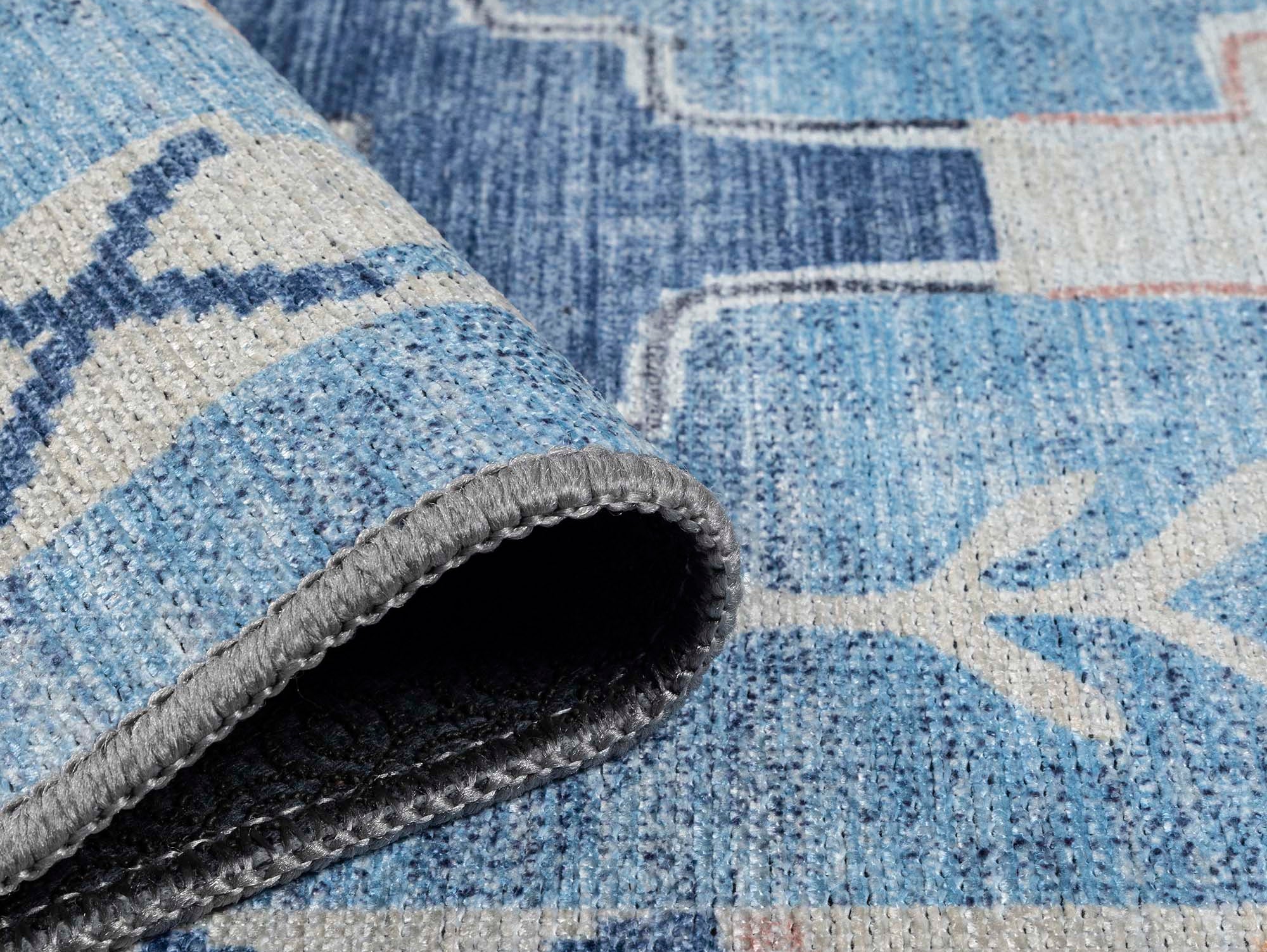 Close-up of a washable spring area rug highlighting soft colors and clean woven texture