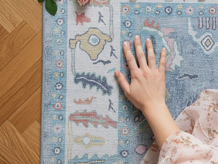 Close-up of a floral pastel area rug highlighting soft spring colors and delicate pattern