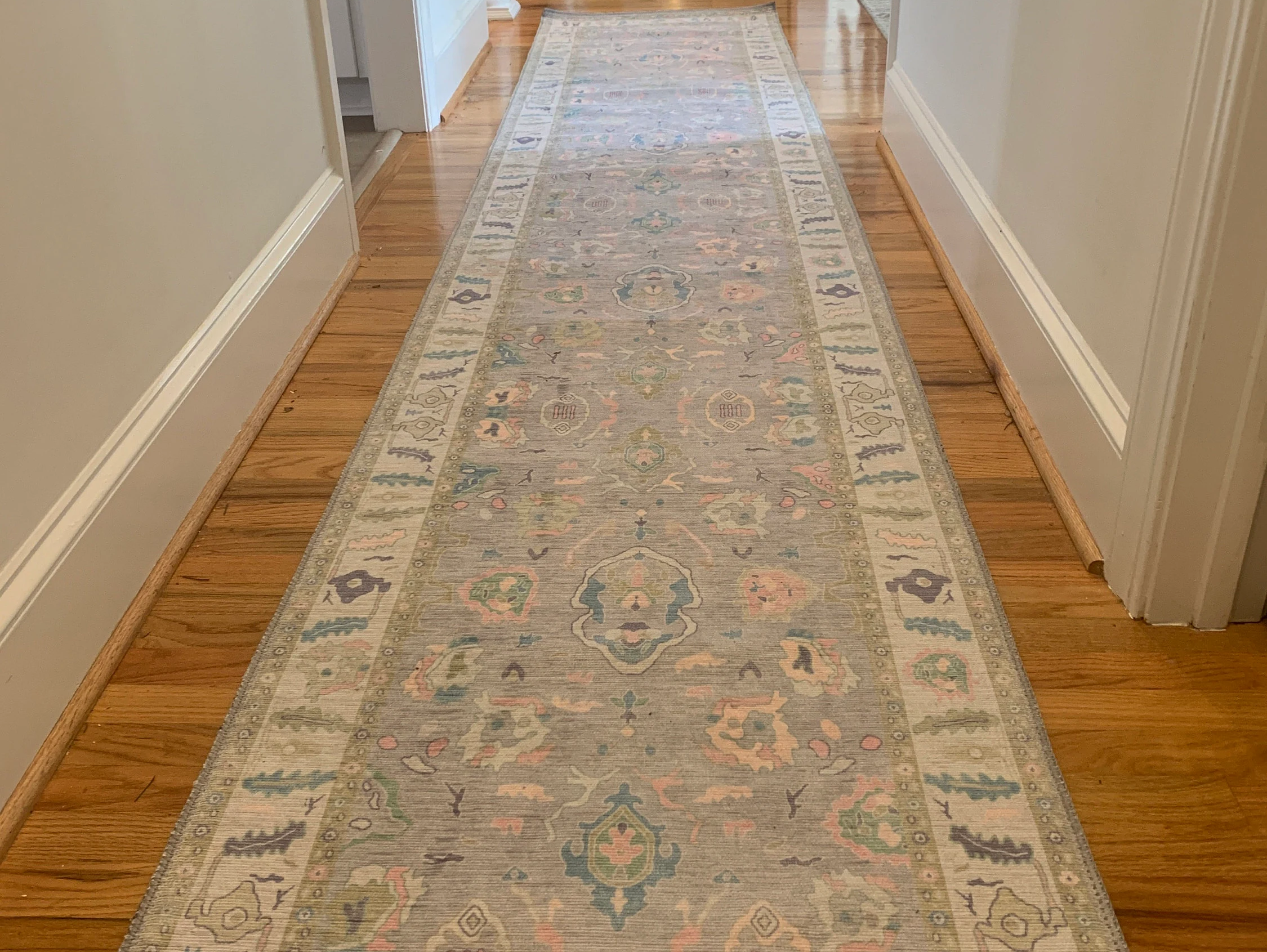 Hallway runner rug styled to guide size, design, and placement in a modern home corridor