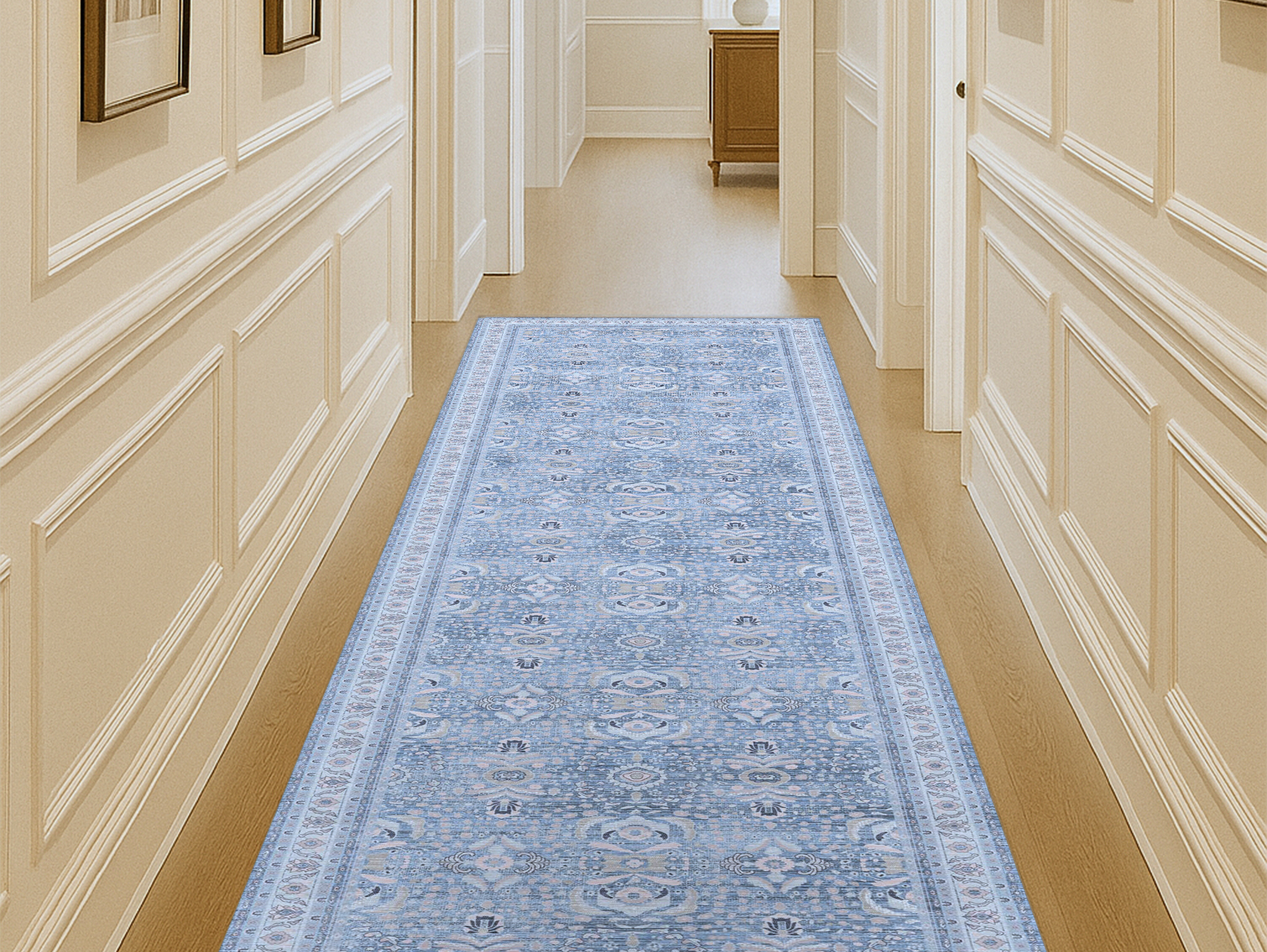 Long hallway featuring a stylish runner rug that adds texture, warmth, and visual interest to the narrow space.