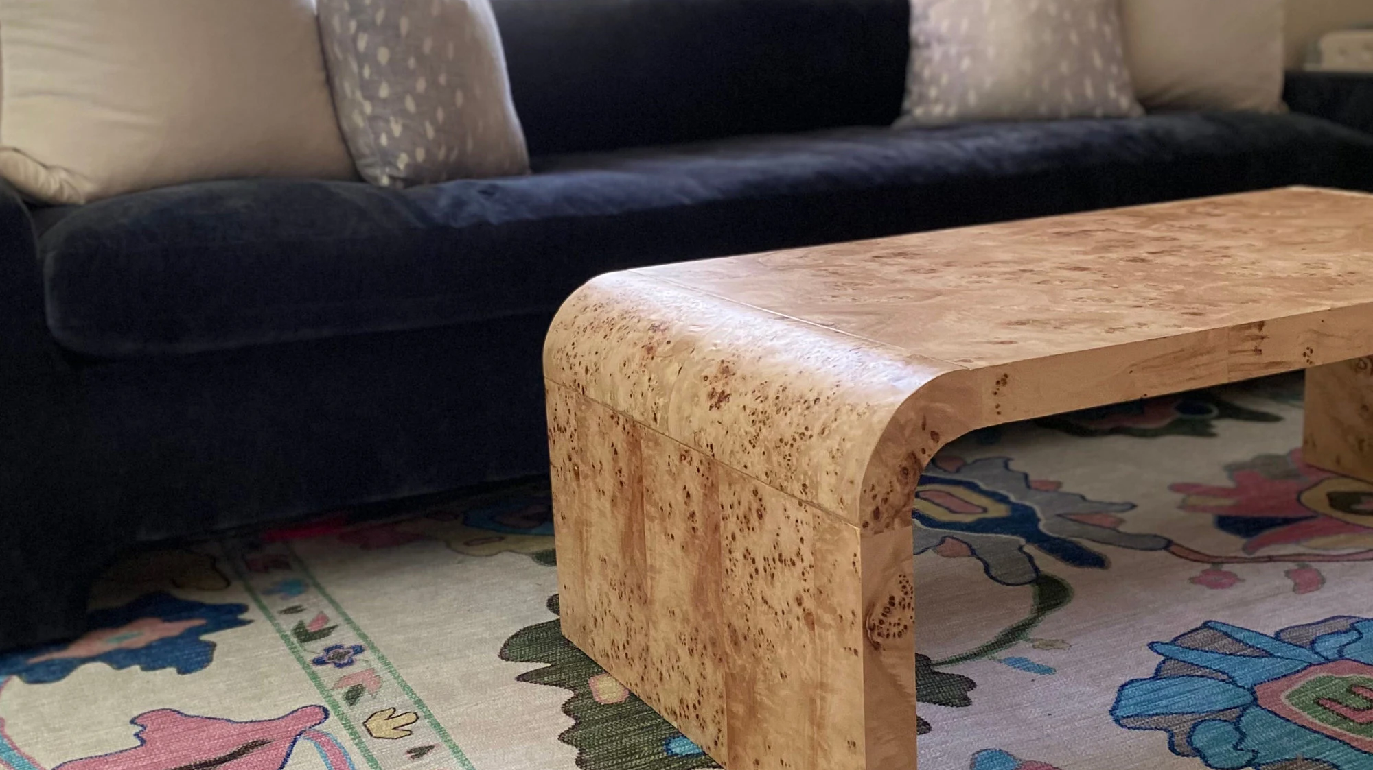 Pastel area rug in a neutral living room adding soft color without overwhelming the space.