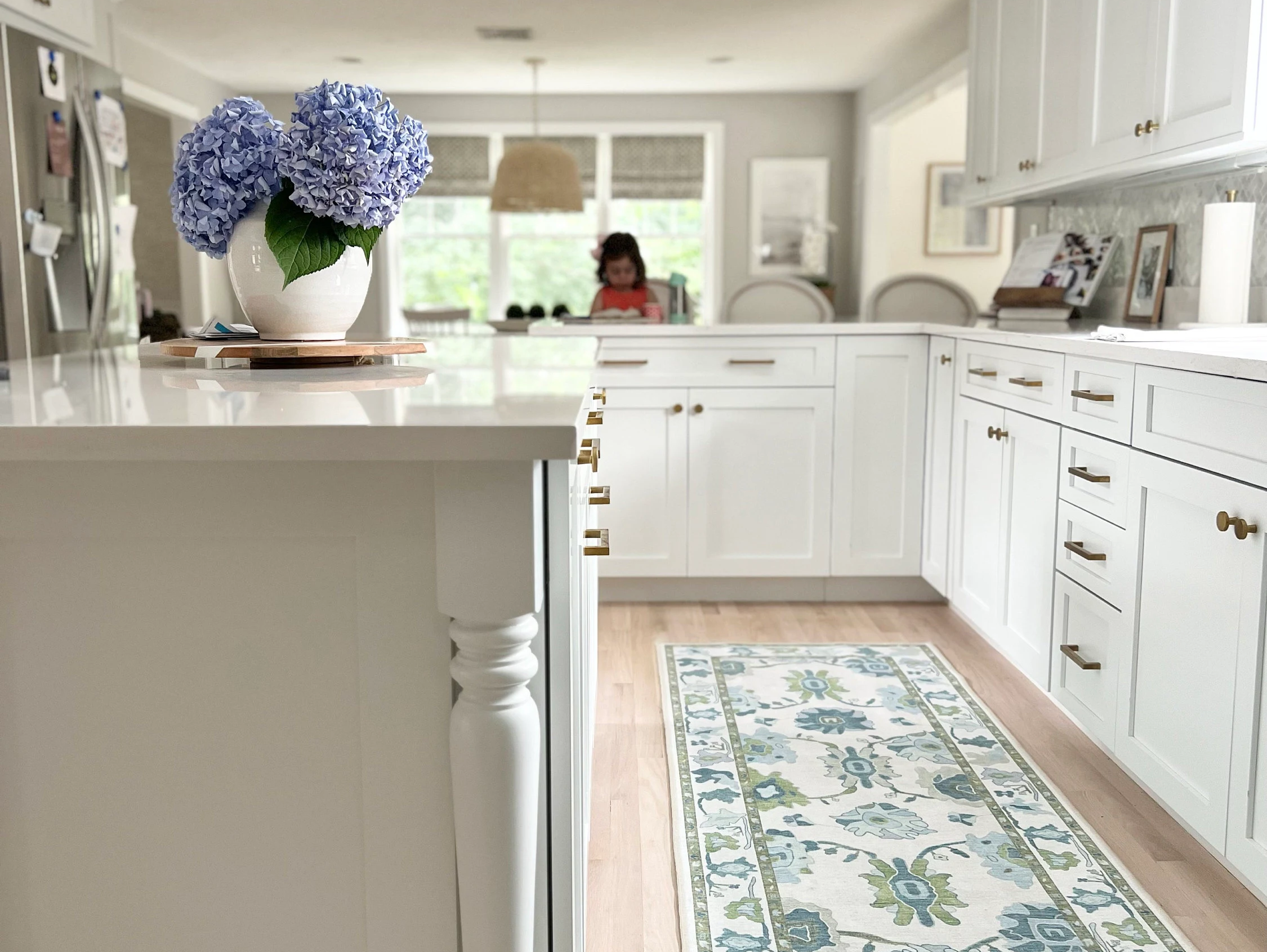 Alienore green and blue Oushak runner rug in a modern kitchen, adding fresh color and vintage-inspired charm to the space.