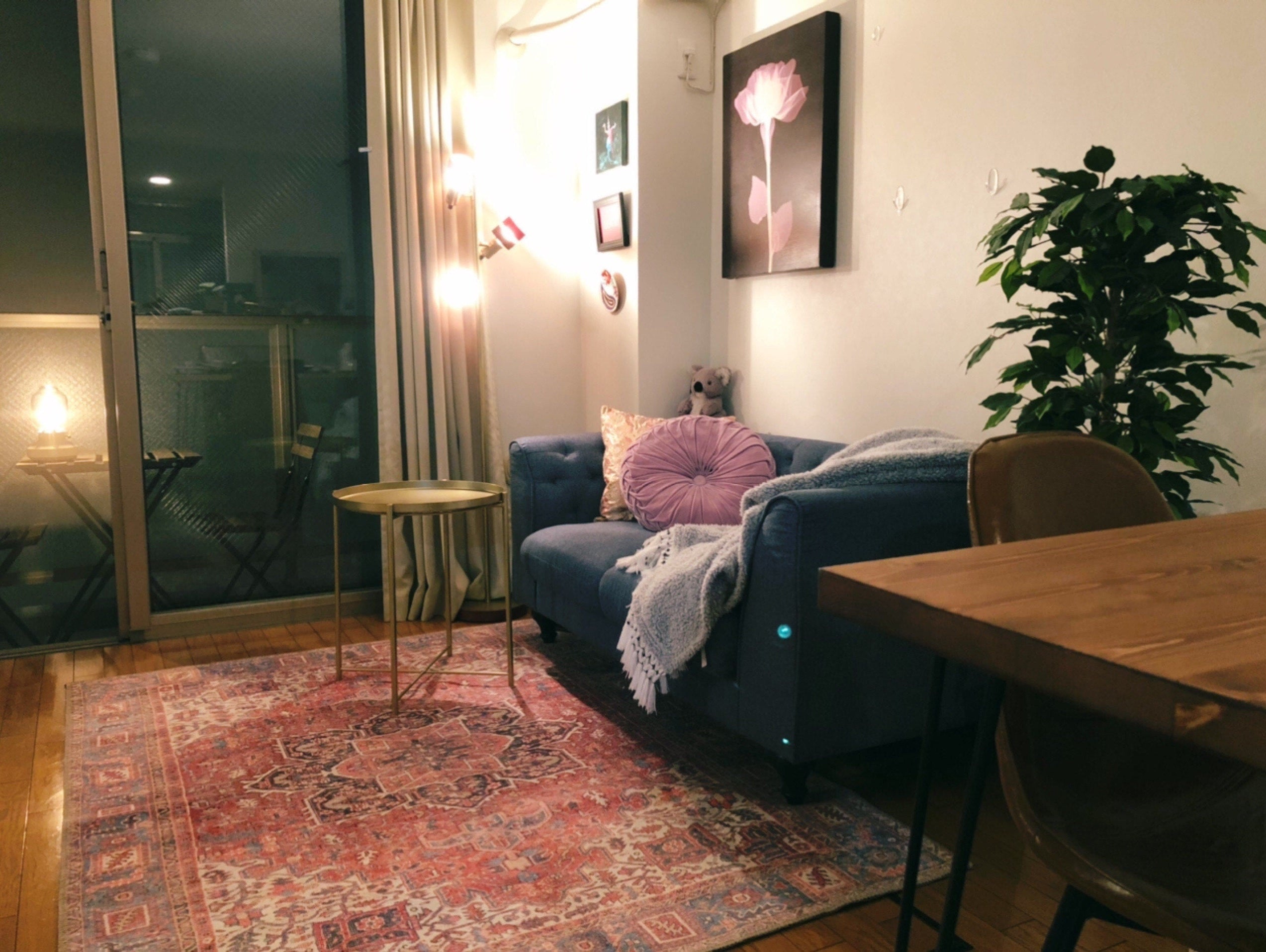 Traditional Turkish rug with intricate patterns in a modern living room, blending vintage charm with contemporary decor.