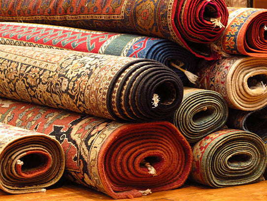 Collection of traditional Turkish rugs featuring intricate handwoven designs, rich colors, and detailed patterns that reflect the art of Turkish weaving