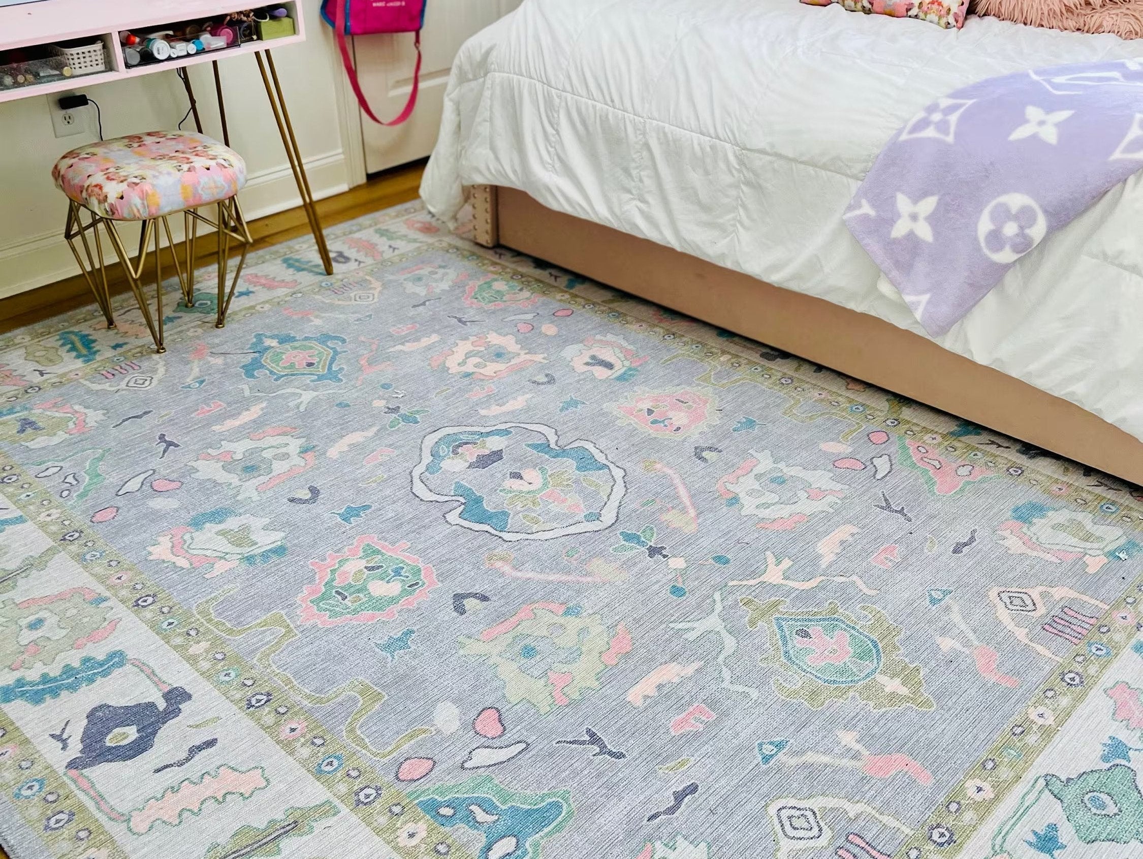 Charming daughterβs room featuring a soft pink pastel washable rug, adding a cozy and stylish touch to the feminine and playful space.
