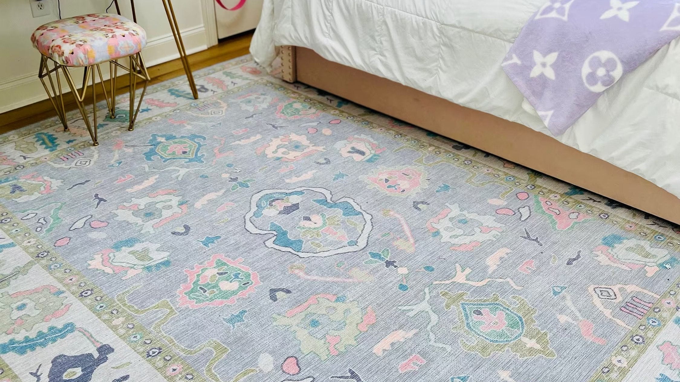 Lavender floral Oushak rug in a girlβs bedroom, creating a soft, calm, and elegant atmosphere with a modern touch