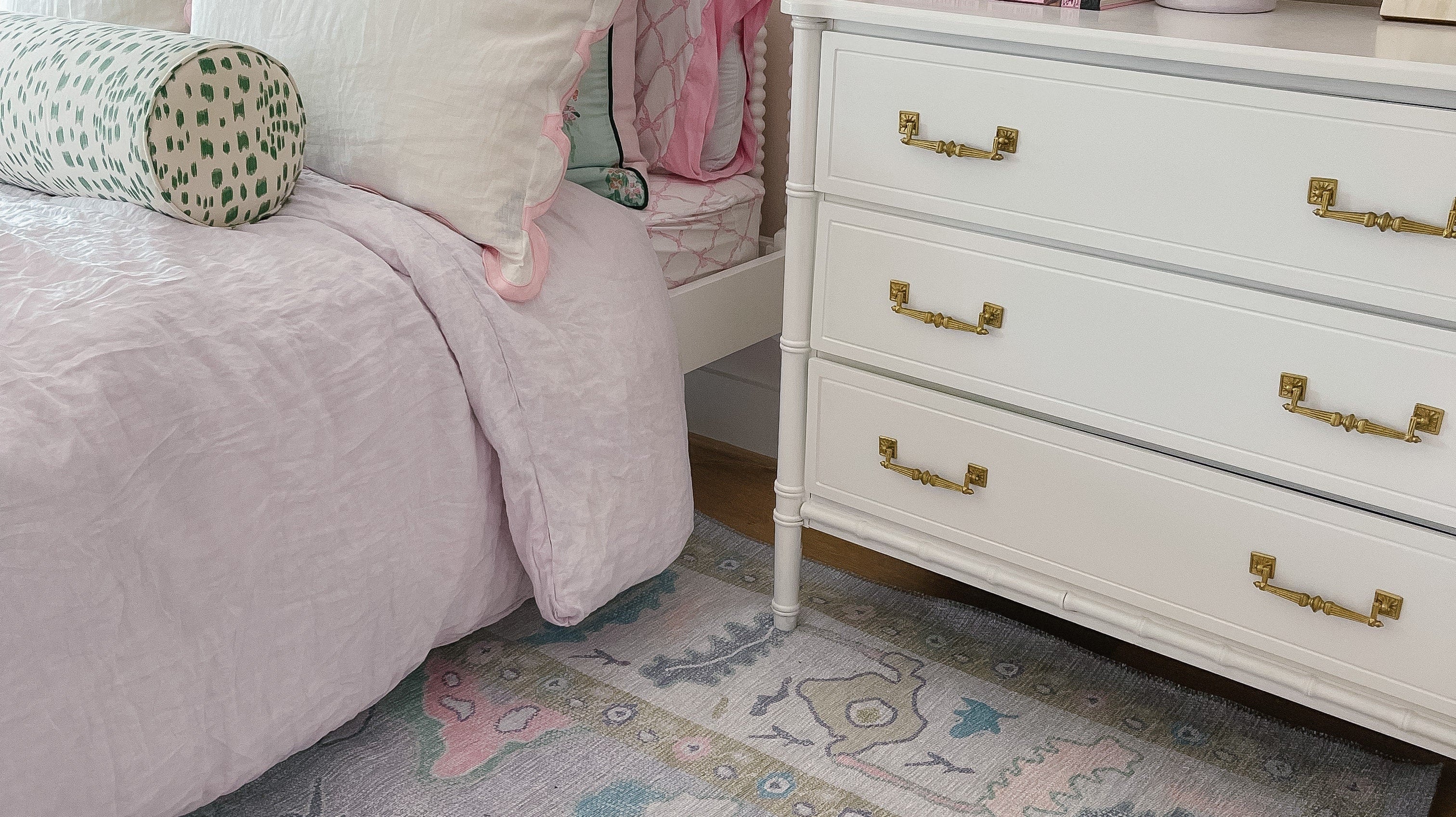 Aviana pastel lavender Oushak rug in a bright bedroom, creating a soft, elegant, and relaxing summer retreat.