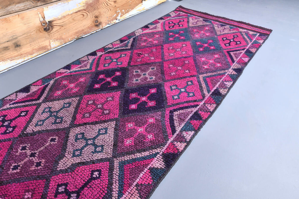Galatea runner: 1970s handmade Anatolian runner with ikat motifs and cotton backing