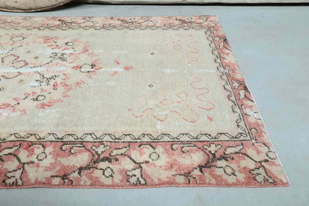 Gulnihal rug: 1970s handmade Anatolian rug with tribal motifs and cotton backing