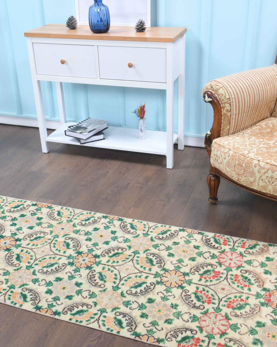 Petraura runner: 1970s handmade Anatolian runner with floral motifs and cotton backing