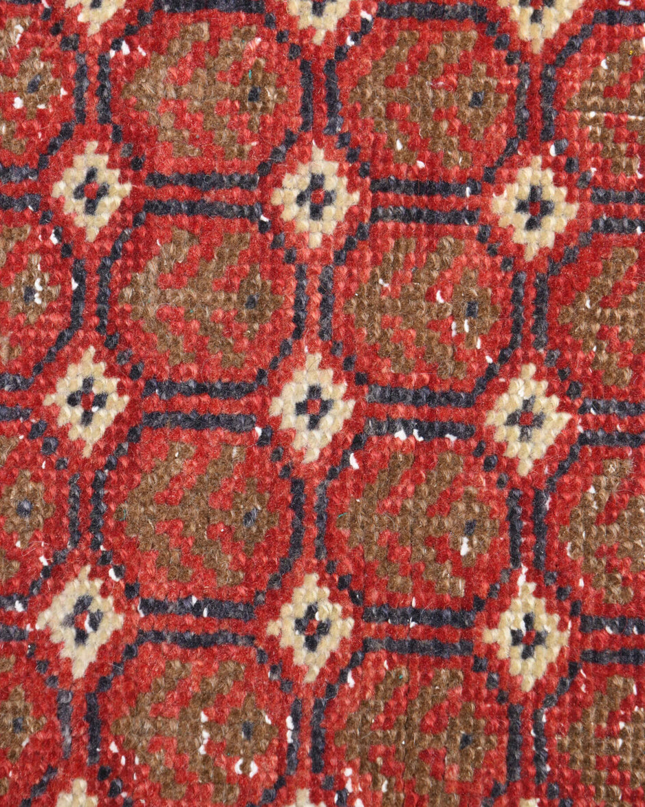 Rhodonia runner: 1970s handmade Anatolian runner with ikat motifs and cotton backing