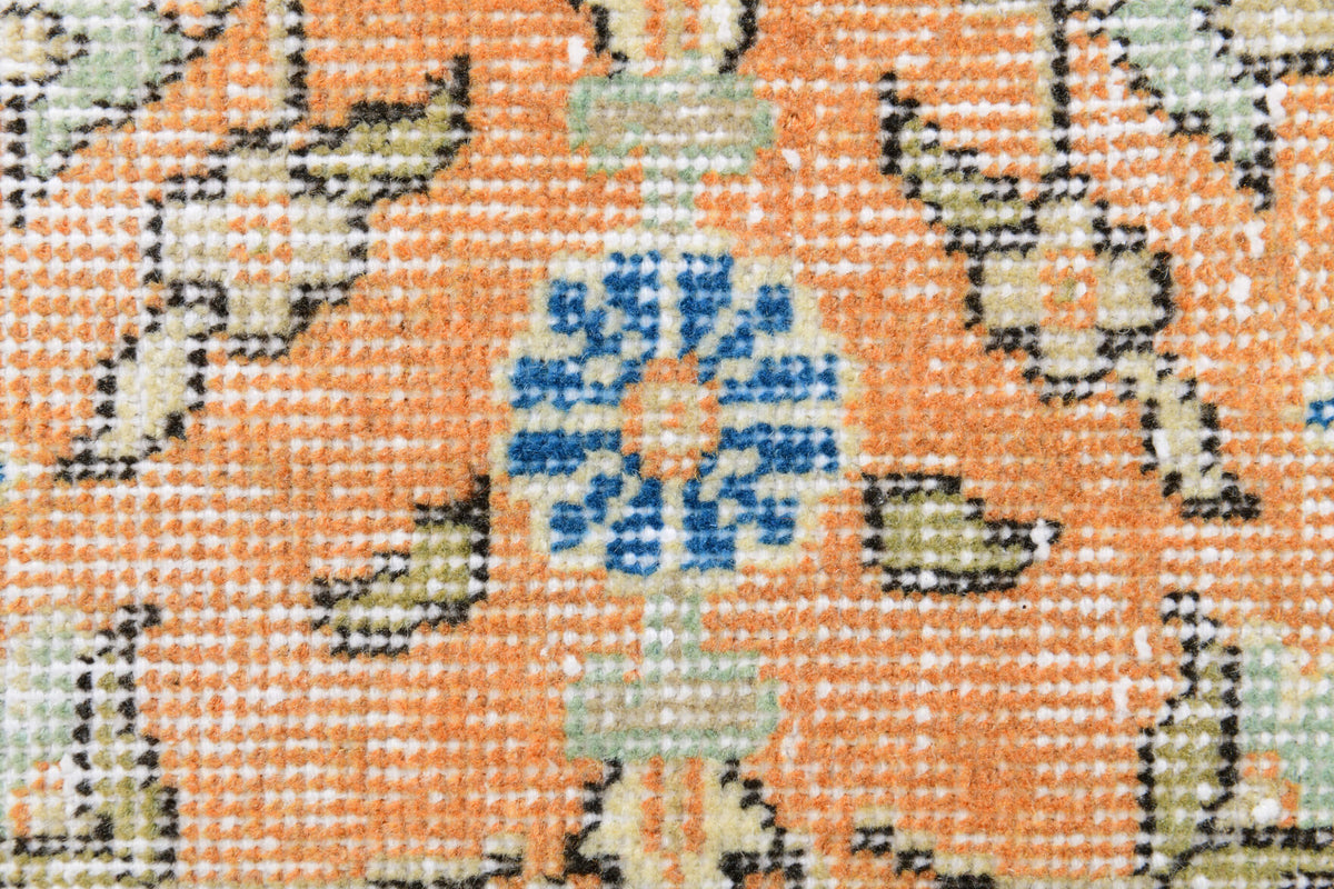 Fidan rug: 1970s handmade Anatolian rug with floral motifs and cotton backing