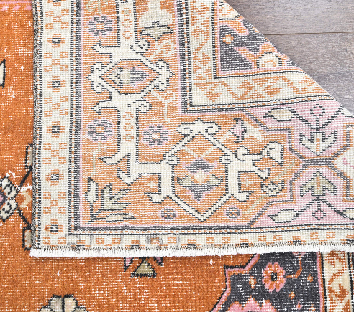 Gokgul rug: 1970s handmade Anatolian rug with bordered motifs and cotton backing