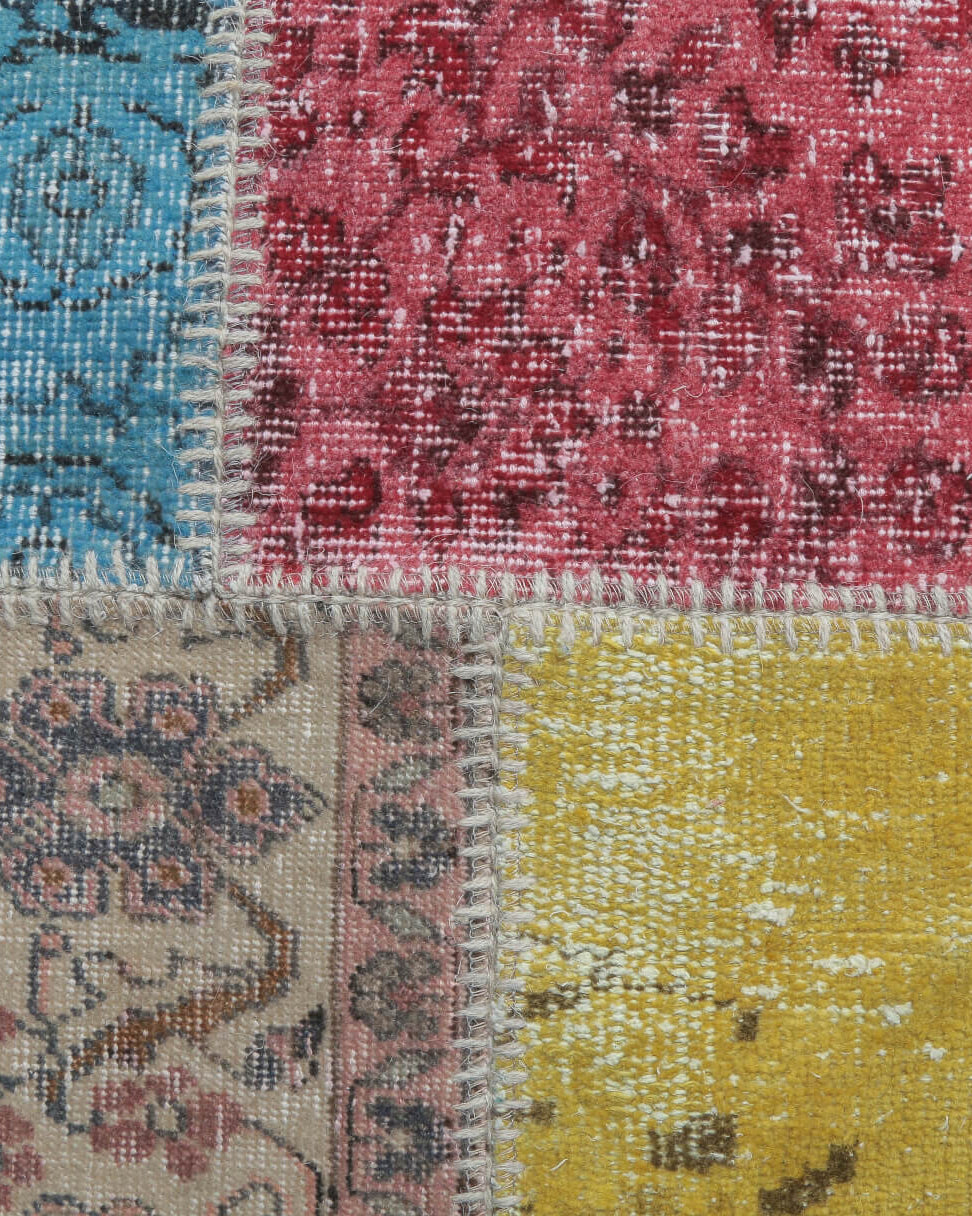Hilal rug: 1970s handmade Anatolian rug with patchwork motifs and fabric backing