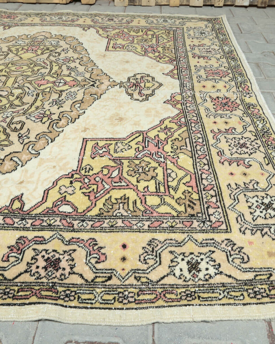 Cerensever rug: 1970s handmade Anatolian rug with floral motifs and cotton backing