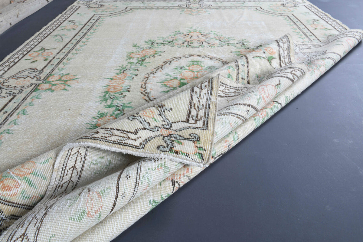 Hilalsel rug: 1970s handmade Anatolian rug with medallion and floral motifs and cotton backing