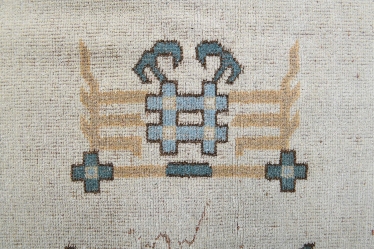 Adadeniz rug: 1970s handmade Anatolian rug with bordered and floral motifs and cotton backing