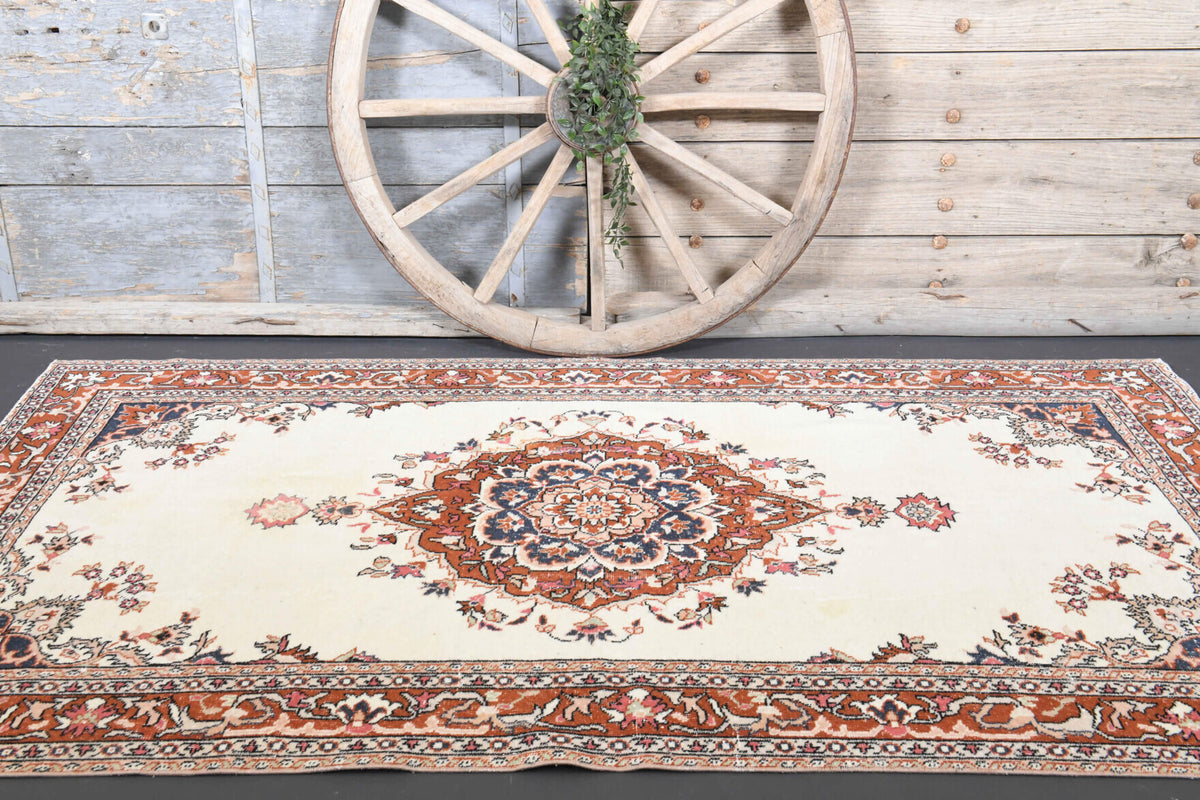 Gunel rug: 1970s handmade Anatolian rug with oriental motifs and cotton backing