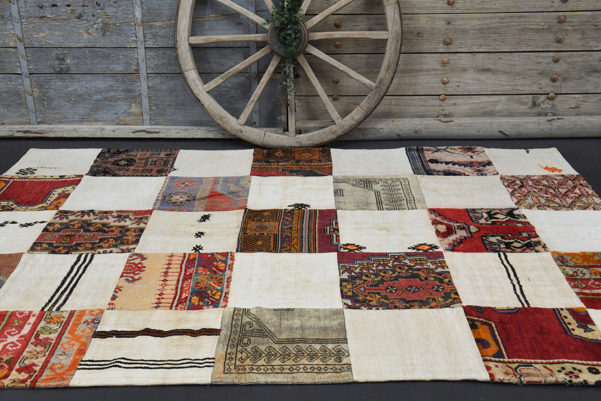 Astrapetra rug: 1970s handmade Anatolian rug with ikat motifs and fabric backing