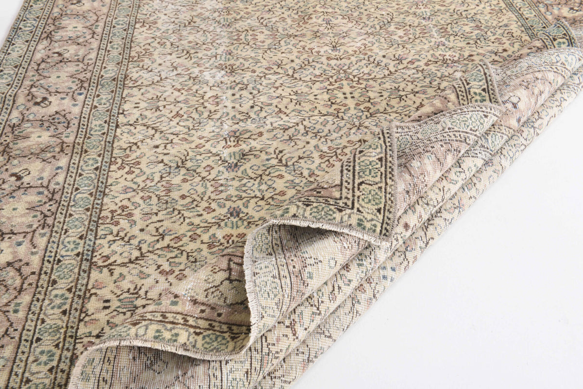 Silabahce rug: 1970s handmade Anatolian rug with floral motifs and cotton backing