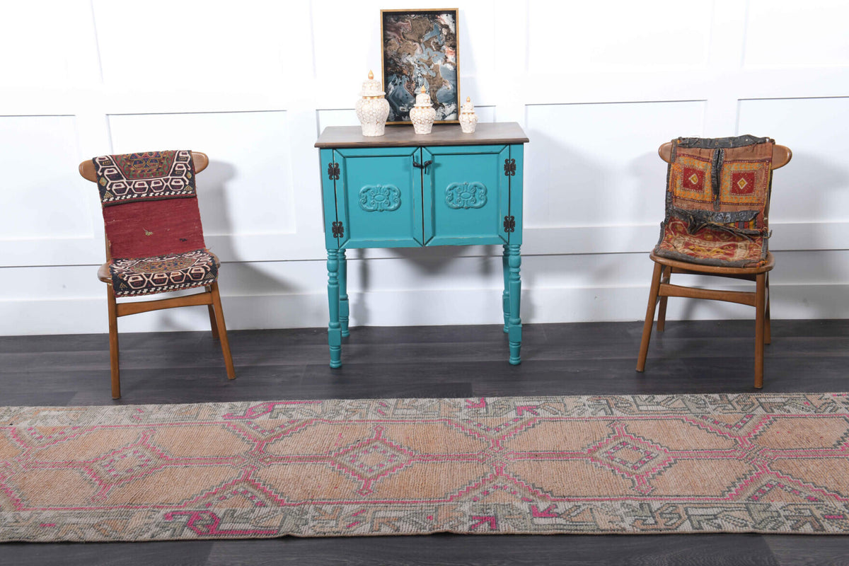 Kleomeda runner: 1970s handmade Anatolian runner with oriental motifs and cotton backing