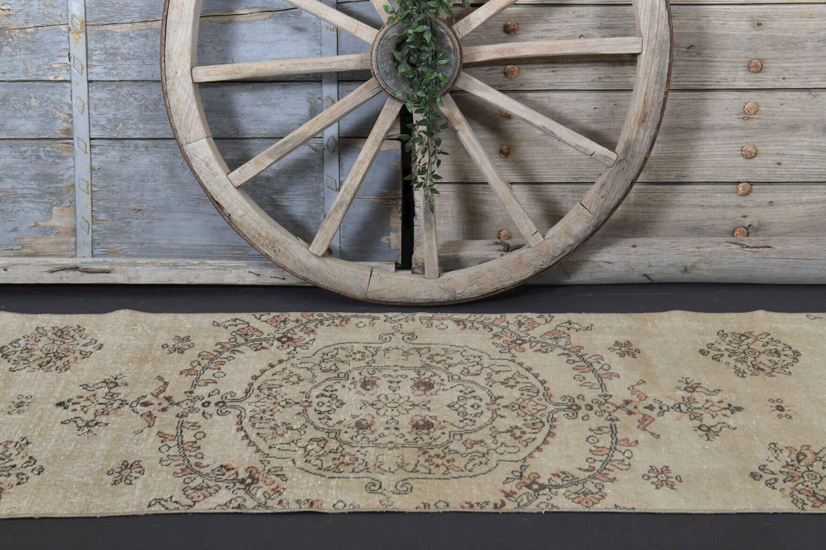 Ianthelampe runner: 1970s handmade Anatolian runner with floral motifs and cotton backing