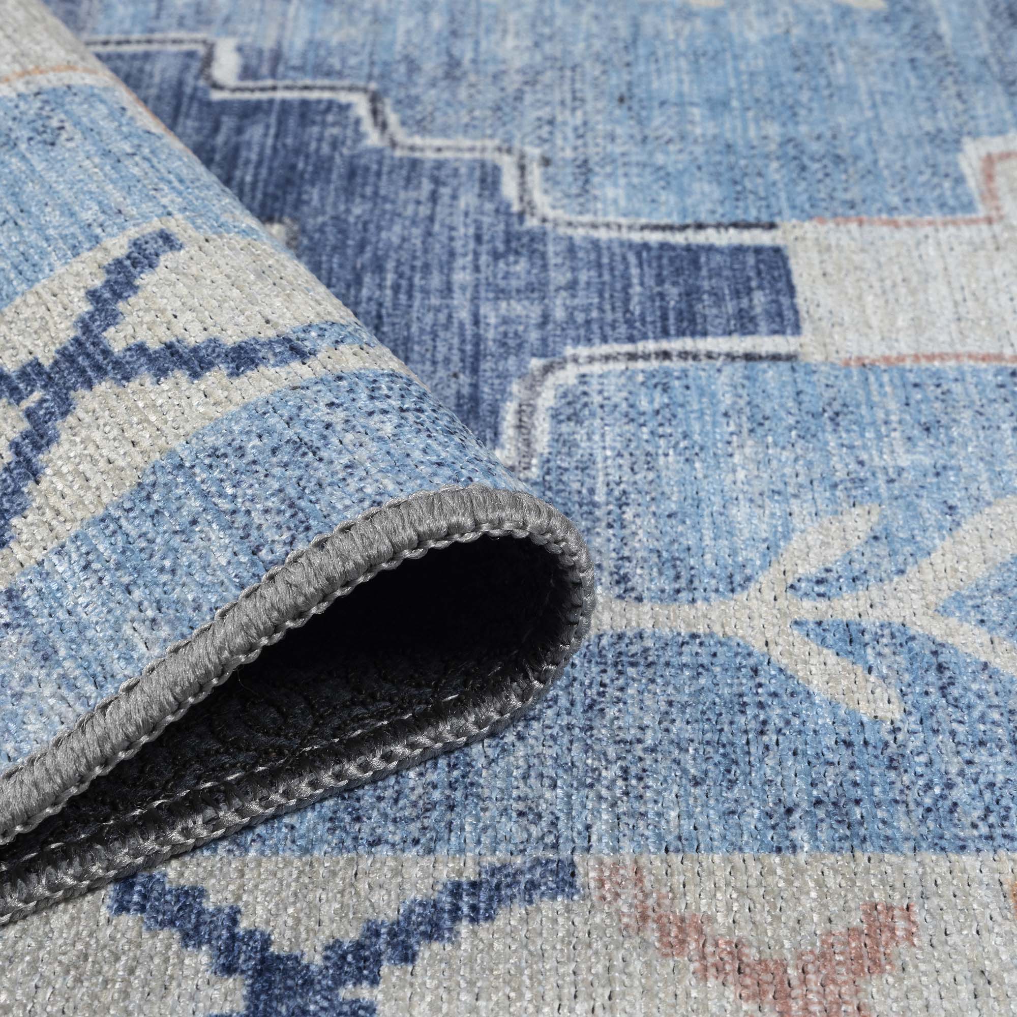 Close-up of a washable spring area rug highlighting soft colors and clean woven texture