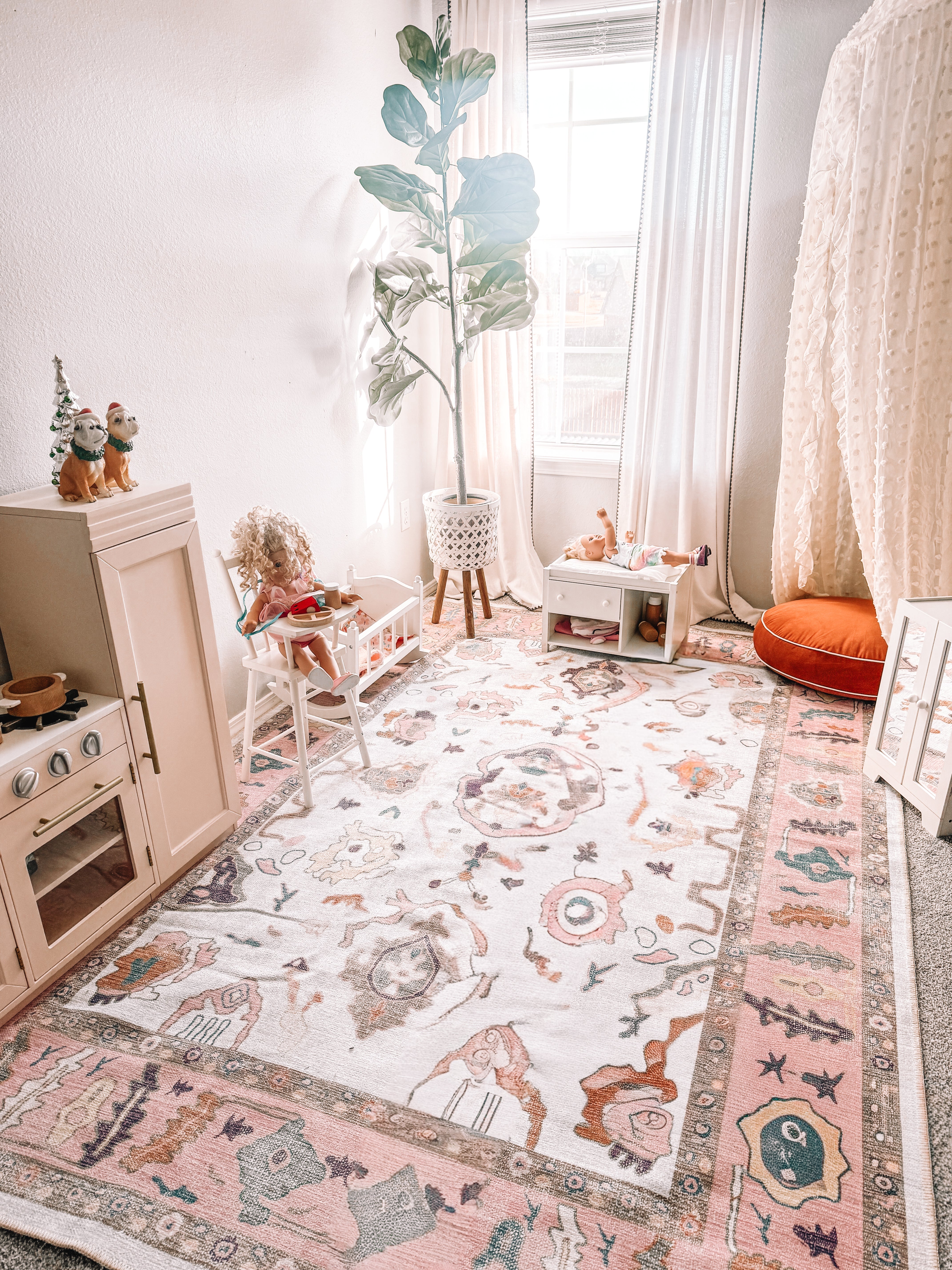 Pink washable rug in a girls’ playroom, creating a soft, comfortable space that supports mood, well-being, and everyday play at home.