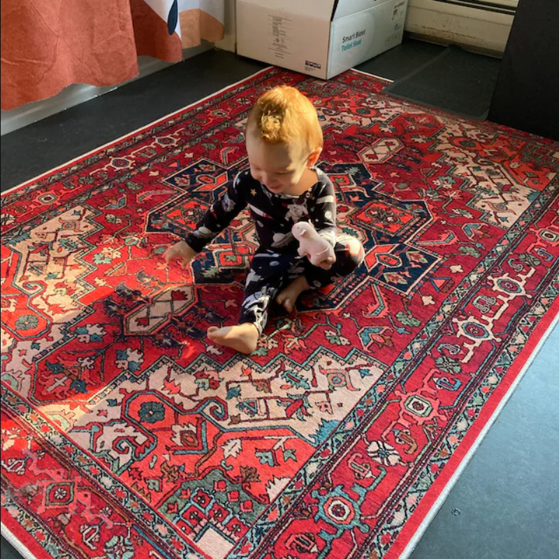 Kid-Friendly Turkish bold red rug giving a warm vibe to the playroom. 