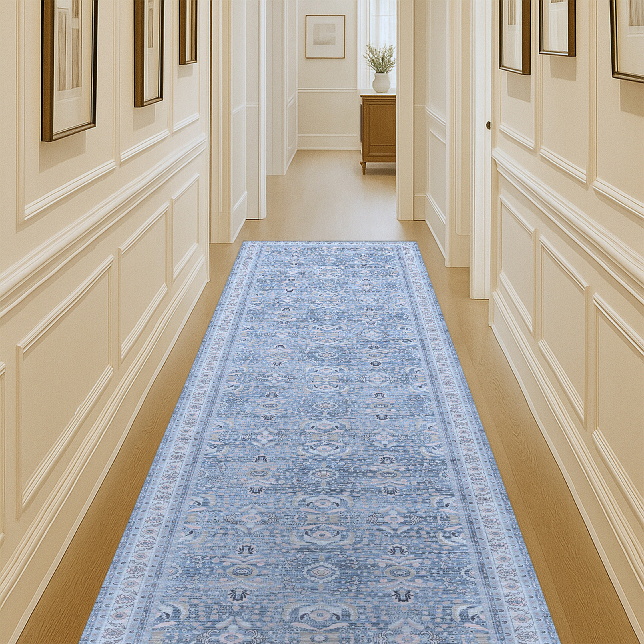 Long hallway featuring a stylish runner rug that adds texture, warmth, and visual interest to the narrow space.