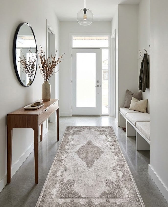 Soft warm-toned rug anchoring a contemporary home entrance