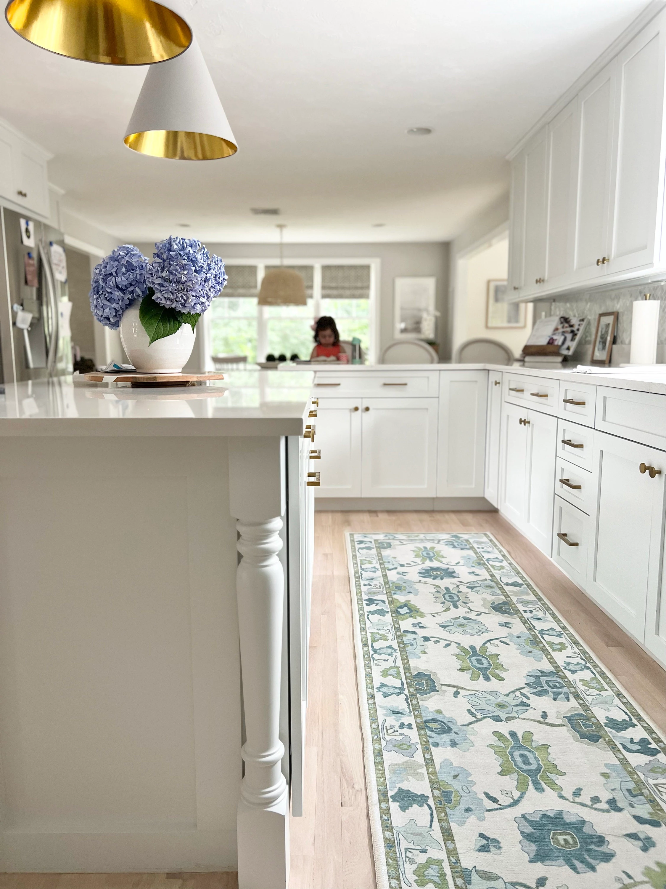 Alienore green and blue Oushak runner rug in a modern kitchen, adding fresh color and vintage-inspired charm to the space.