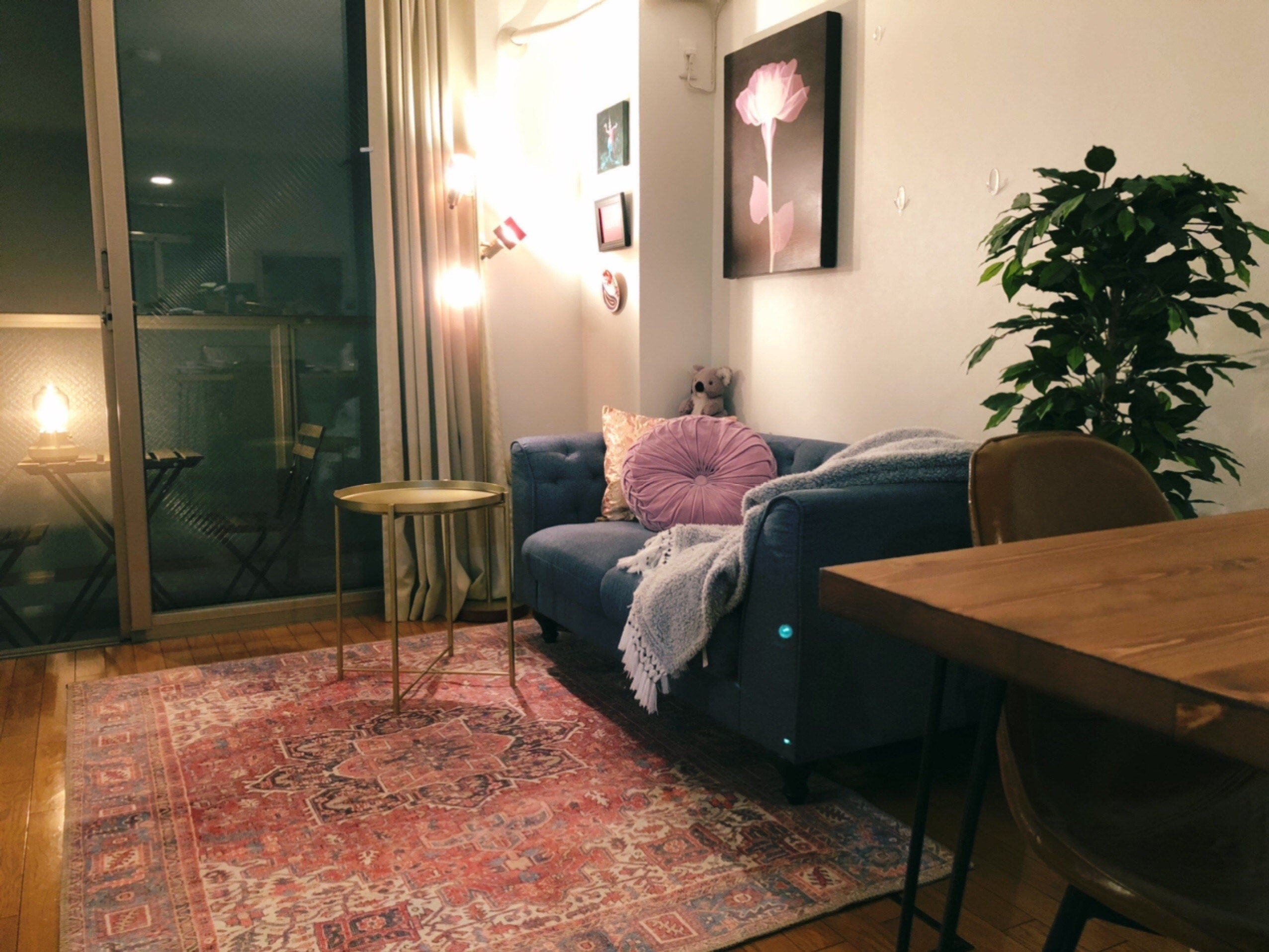 Traditional Turkish rug with intricate patterns in a modern living room, blending vintage charm with contemporary decor.