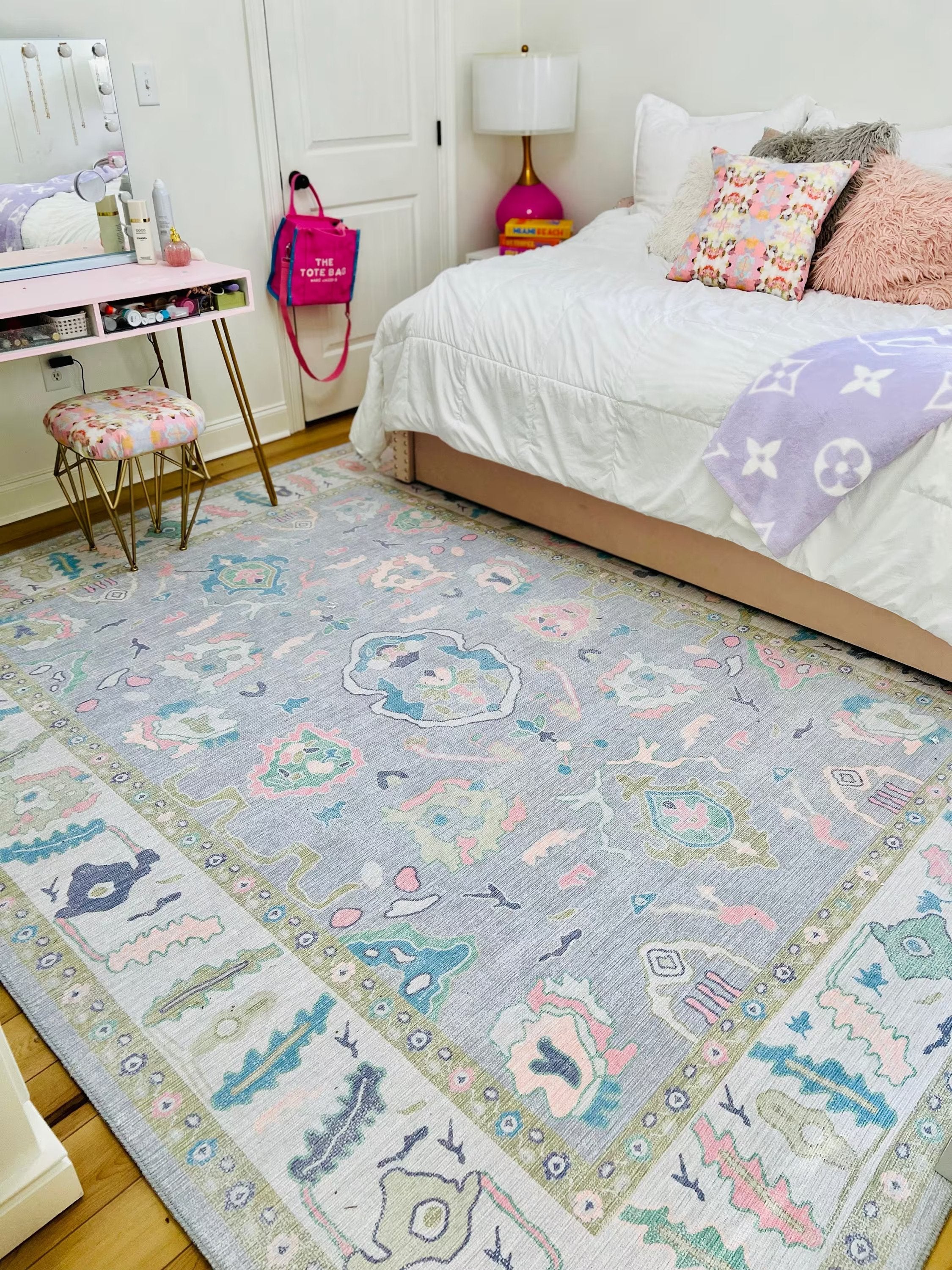 Lavender floral Oushak rug in a girl’s bedroom, creating a soft, calm, and elegant atmosphere with a modern touch