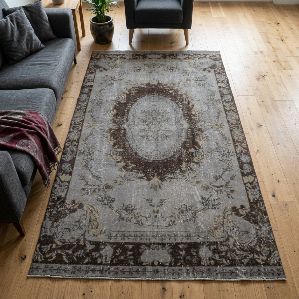 Tribal and floral pattern on the Nezihe Aybel vintage area rug – handmade in Anatolia, Turkey