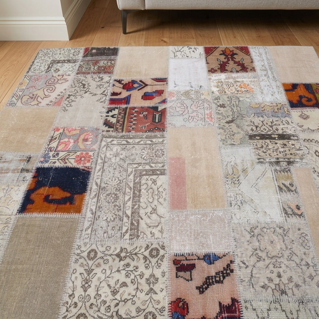 Tribal pattern on the Ambrolyra vintage patchwork area rug – handmade in Anatolia, Turkey