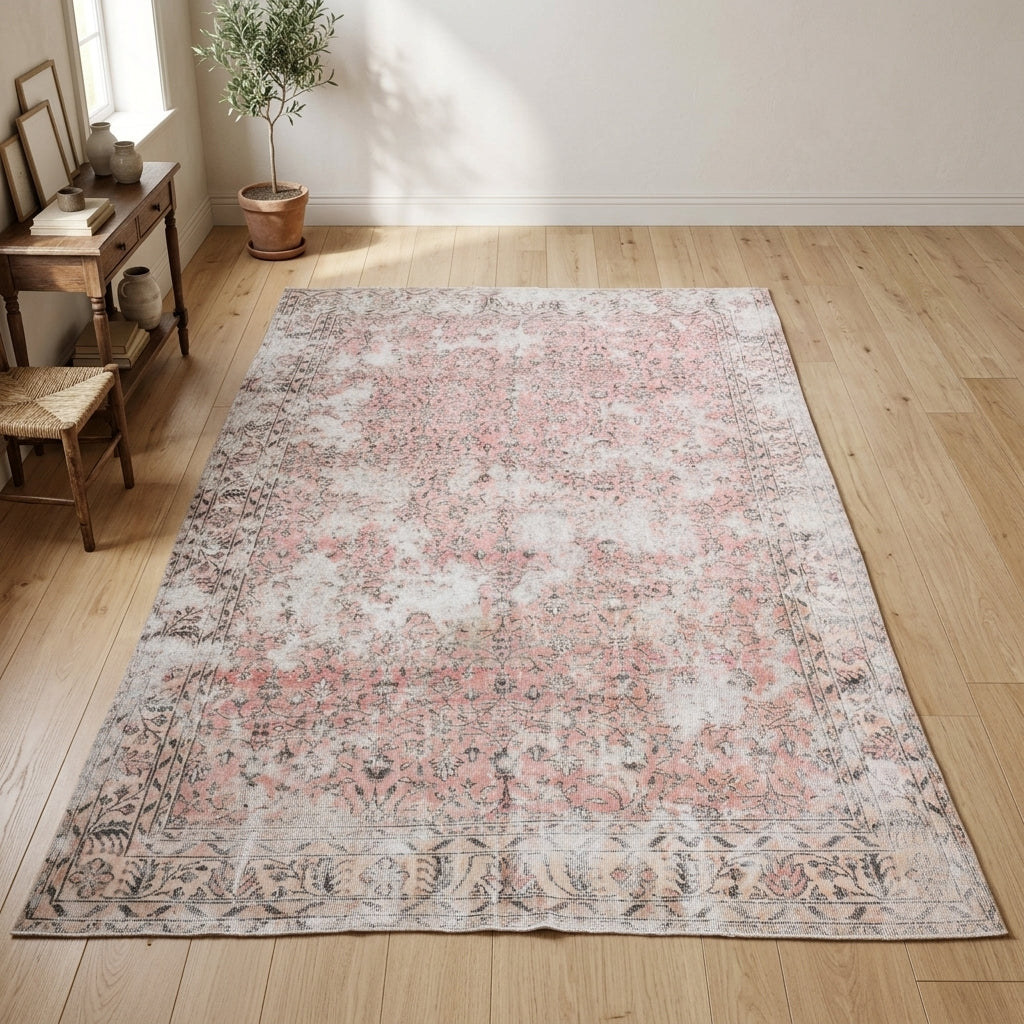 Floral pattern on the Zuhrenisin distressed vintage area rug – handmade in Anatolia, Turkey