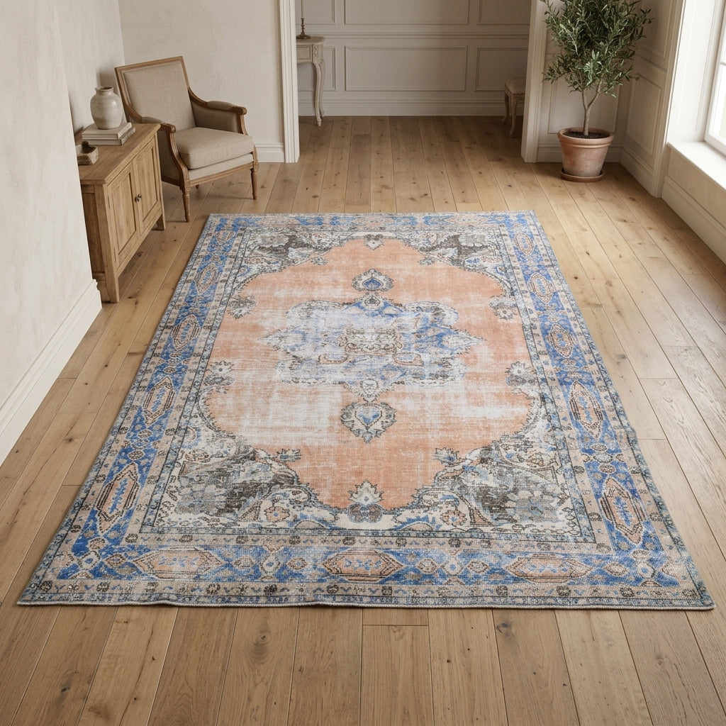 Floral and bordered pattern on the Zoe vintage area rug – handmade in Anatolia, Turkey