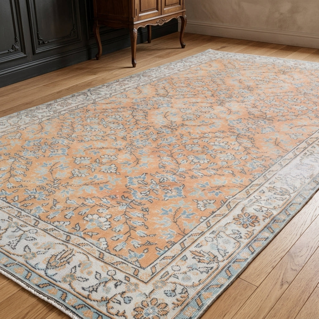 Bordered and floral pattern on the Nikomira vintage area rug – handmade in Anatolia, Turkey