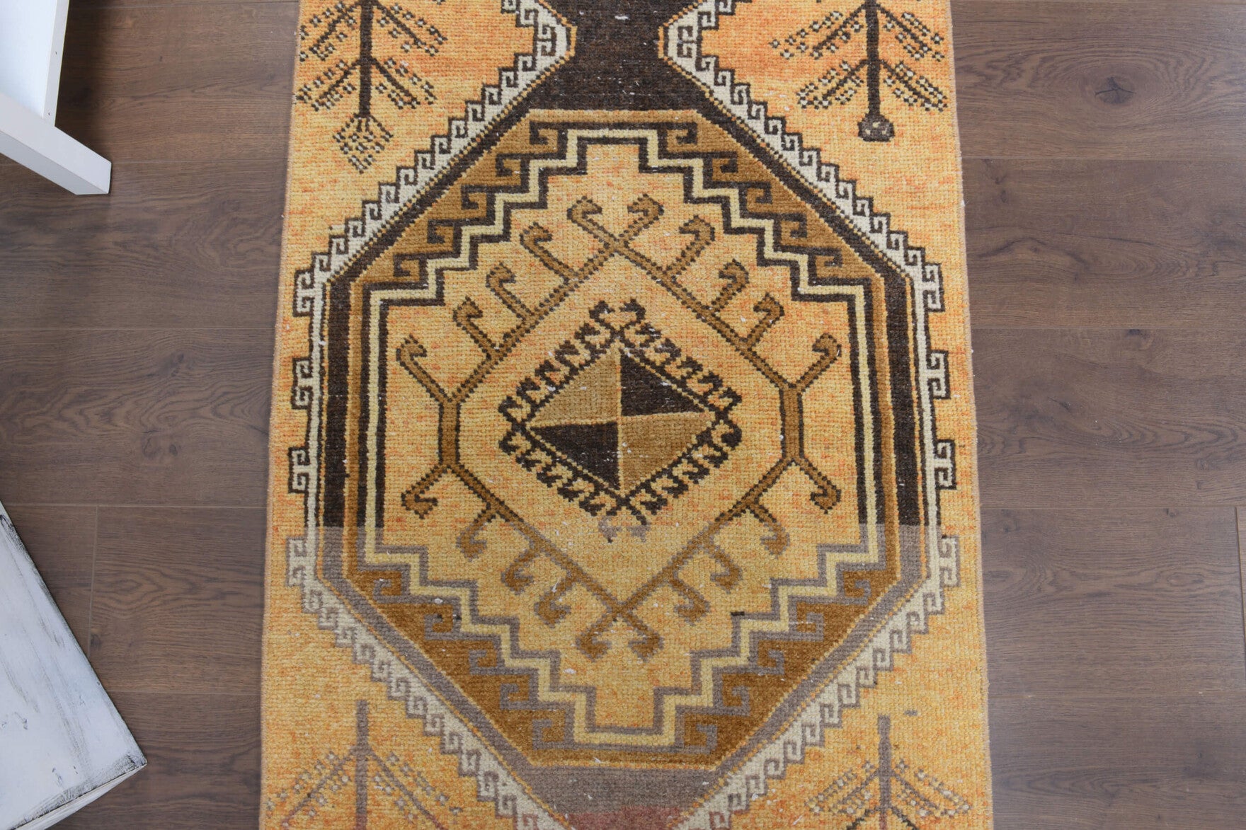Hilalpare runner: 1970s handmade Anatolian runner with tribal motifs and cotton backing