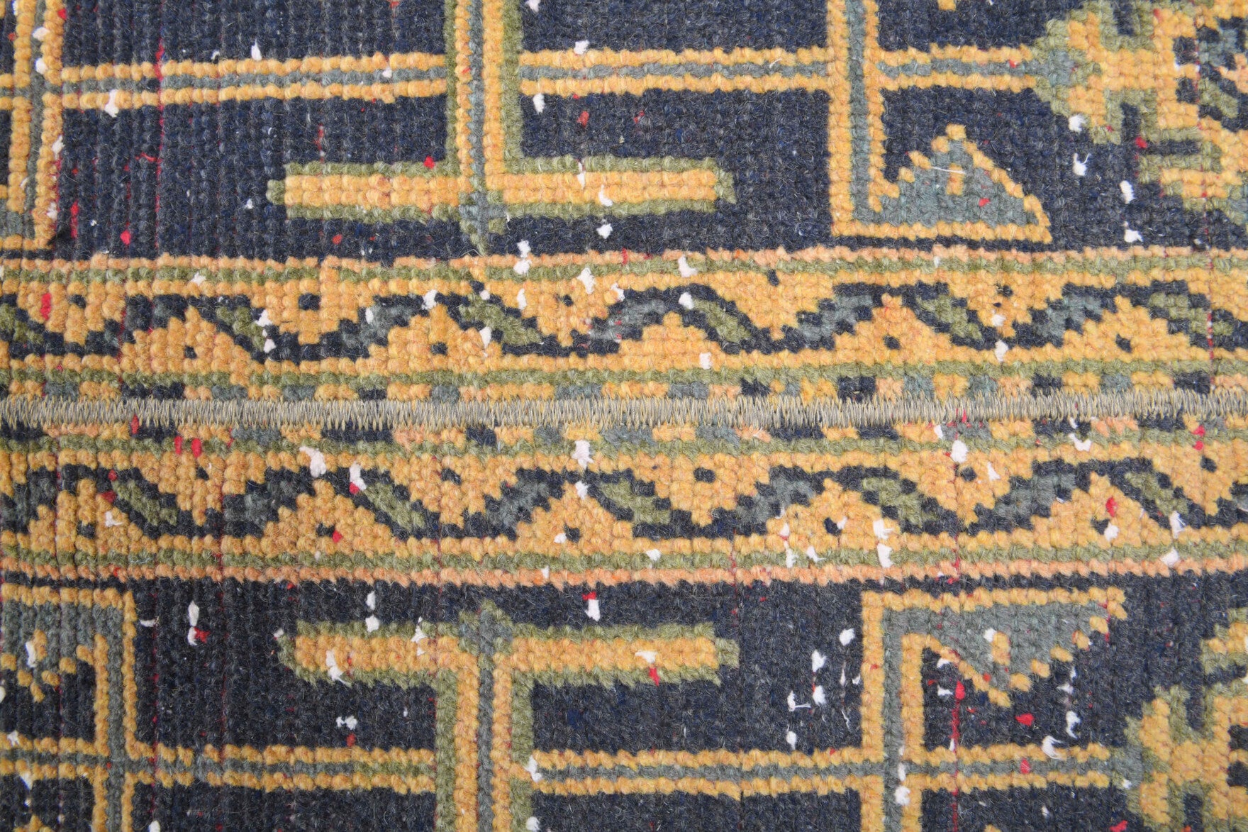 Amaranththalia runner: 1970s handmade Anatolian runner with ikat motifs and fabric backing
