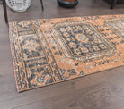 Ardicnaz runner: 1970s handmade Anatolian runner with floral motifs and cotton backing